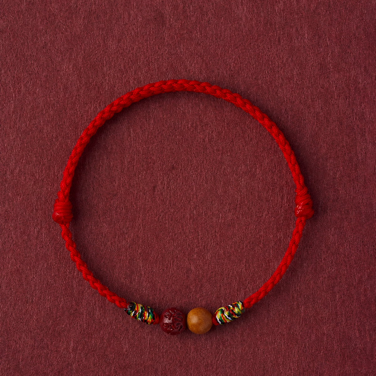 Sacred Orient Peach Wood and Cinnabar Braided Bracelet – product image 1