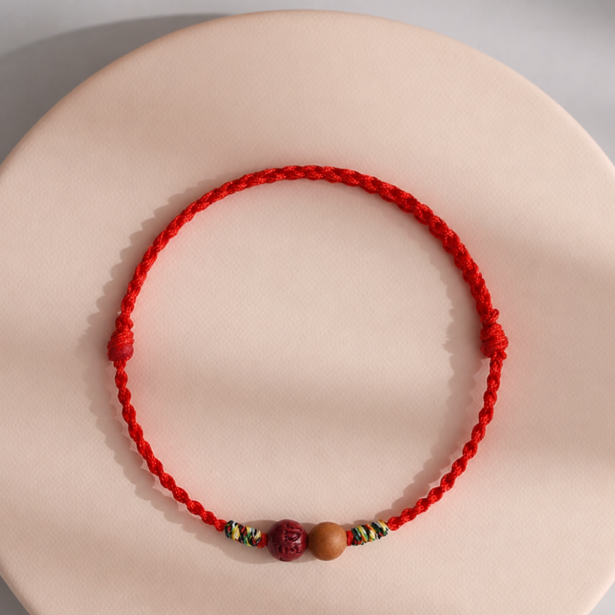 Sacred Orient Peach Wood and Cinnabar Braided Bracelet – product image 5