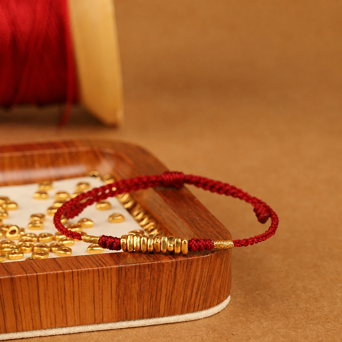Gold-tone bead braided cord bracelet and anklet in red and black cord