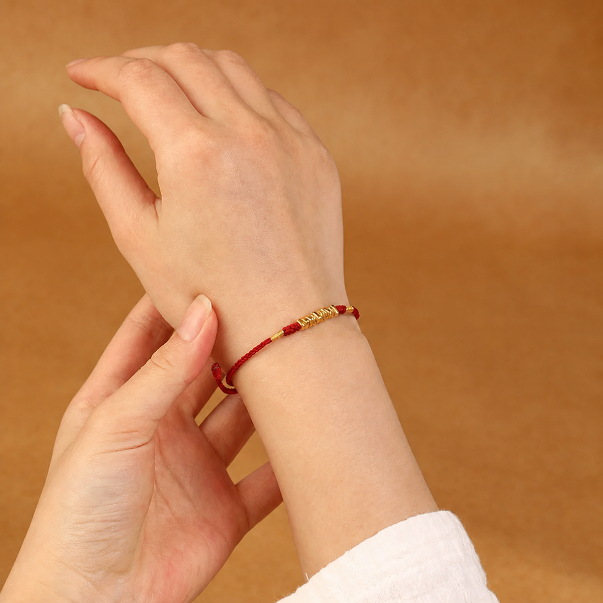 Gold-tone bead braided cord bracelet and anklet in red and black cord